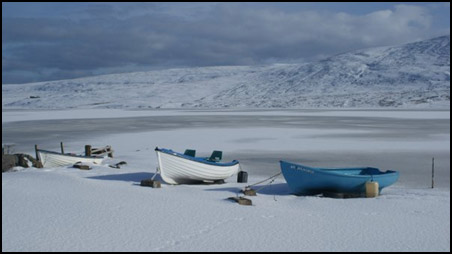 Boats on frozen loch