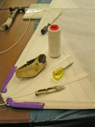 incomplete sail with tools