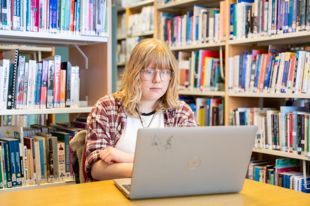 A student studying in the library