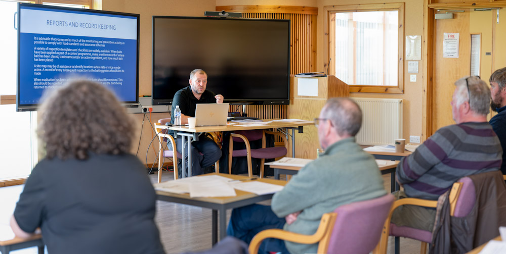 A photography of students in a classroom at a short course