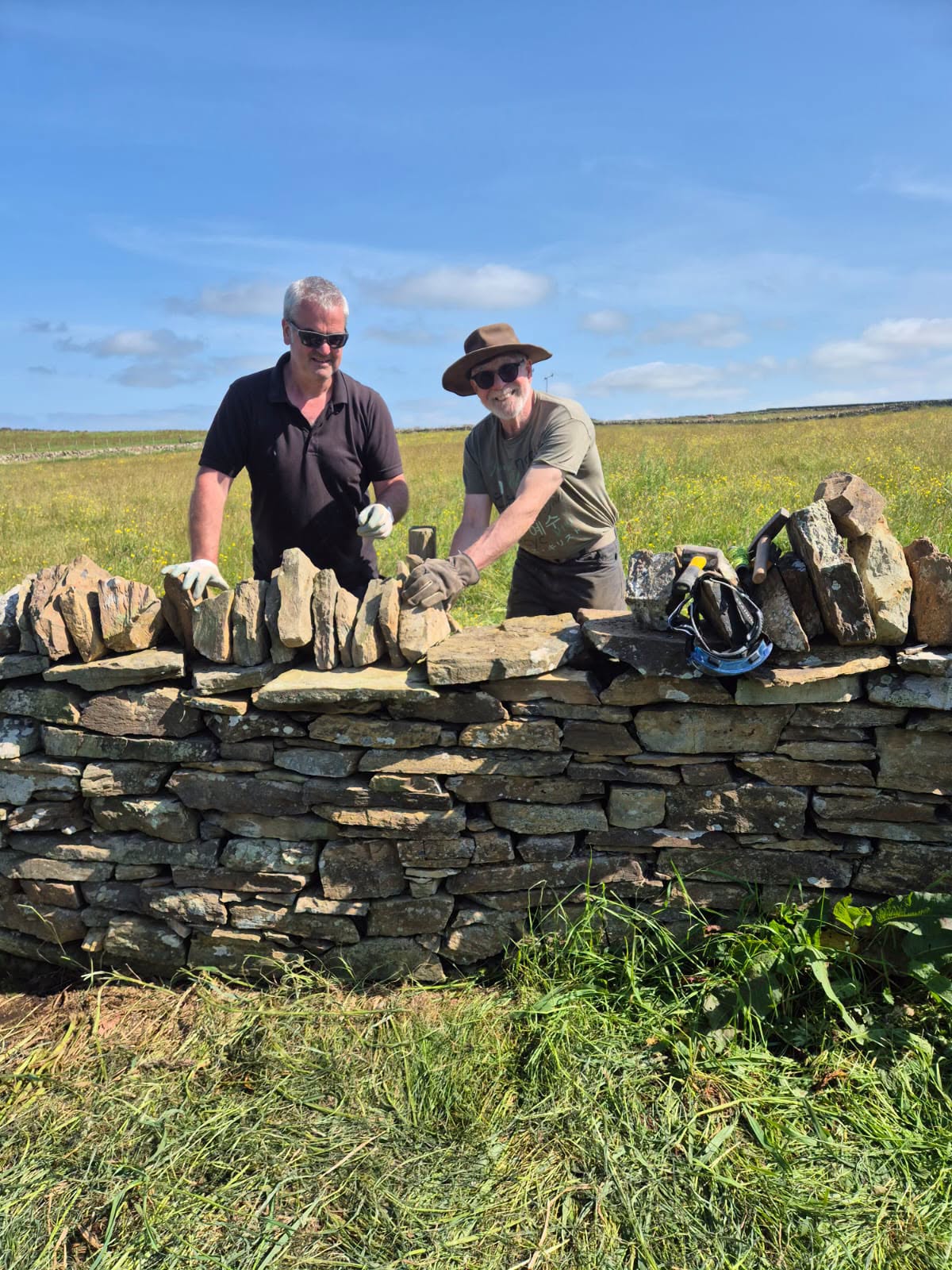 Students building a dry stone wall