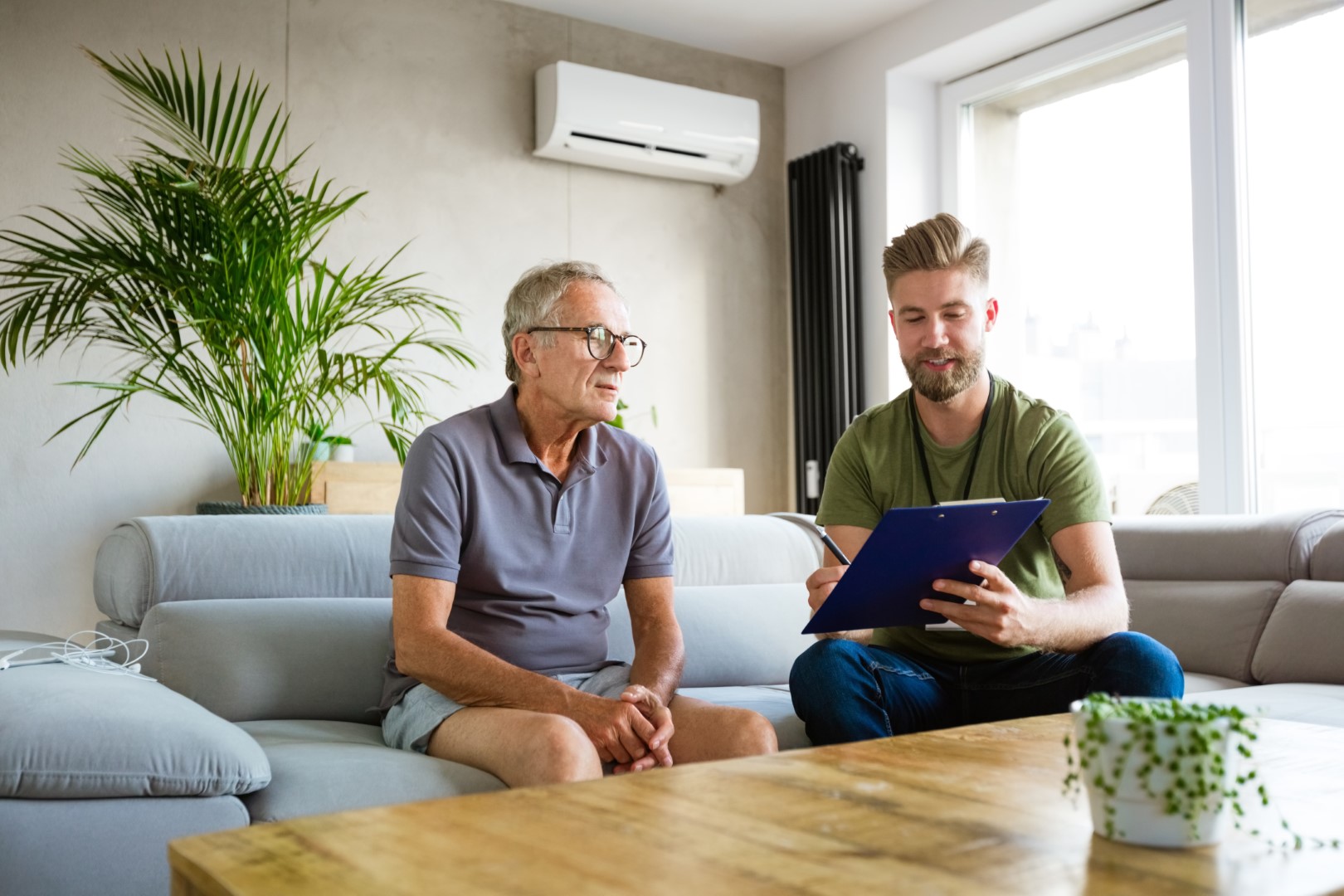 Two people filling out a form