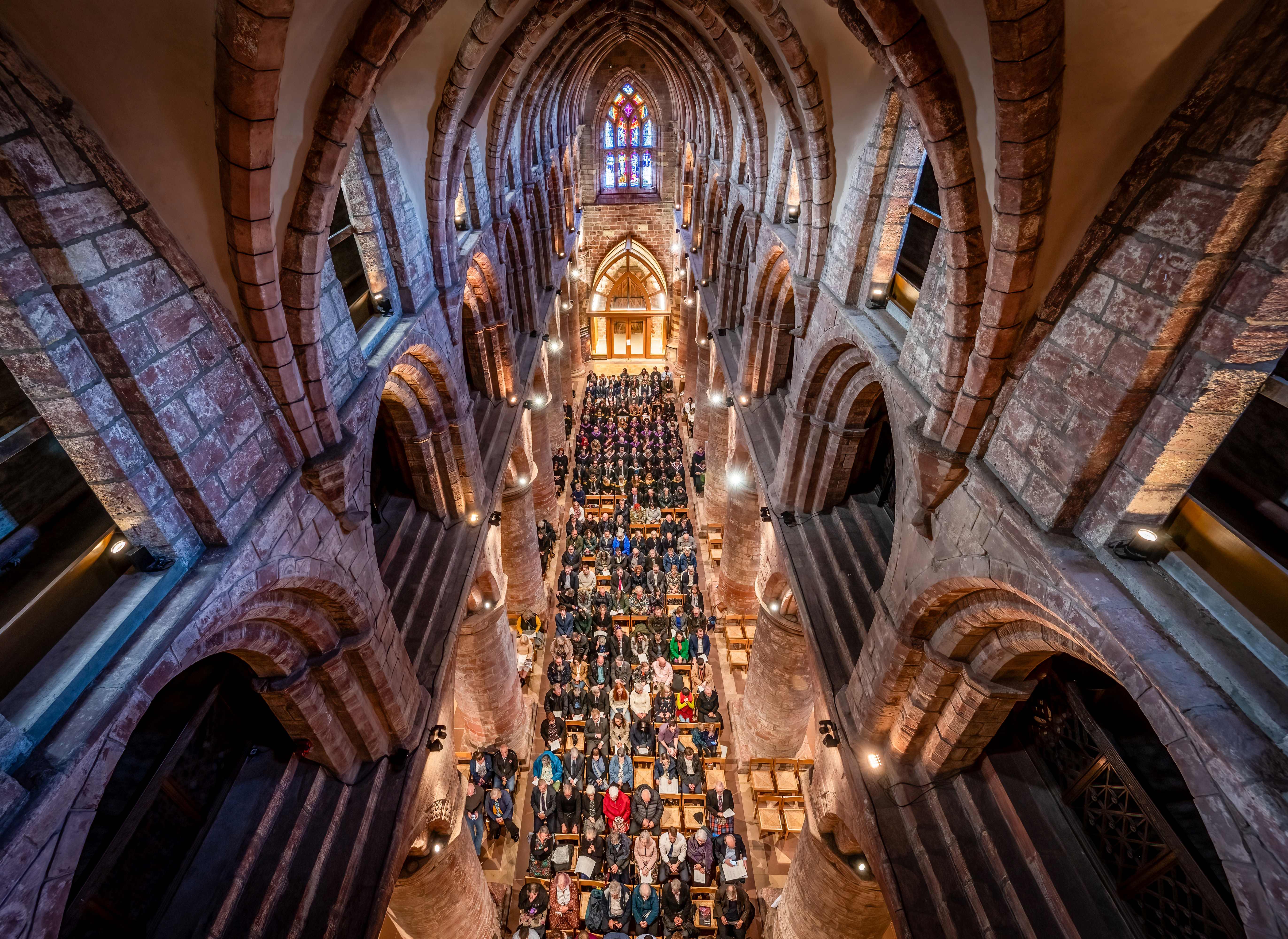 Eagle eye view of graduation ceremony in st magnus cathedral