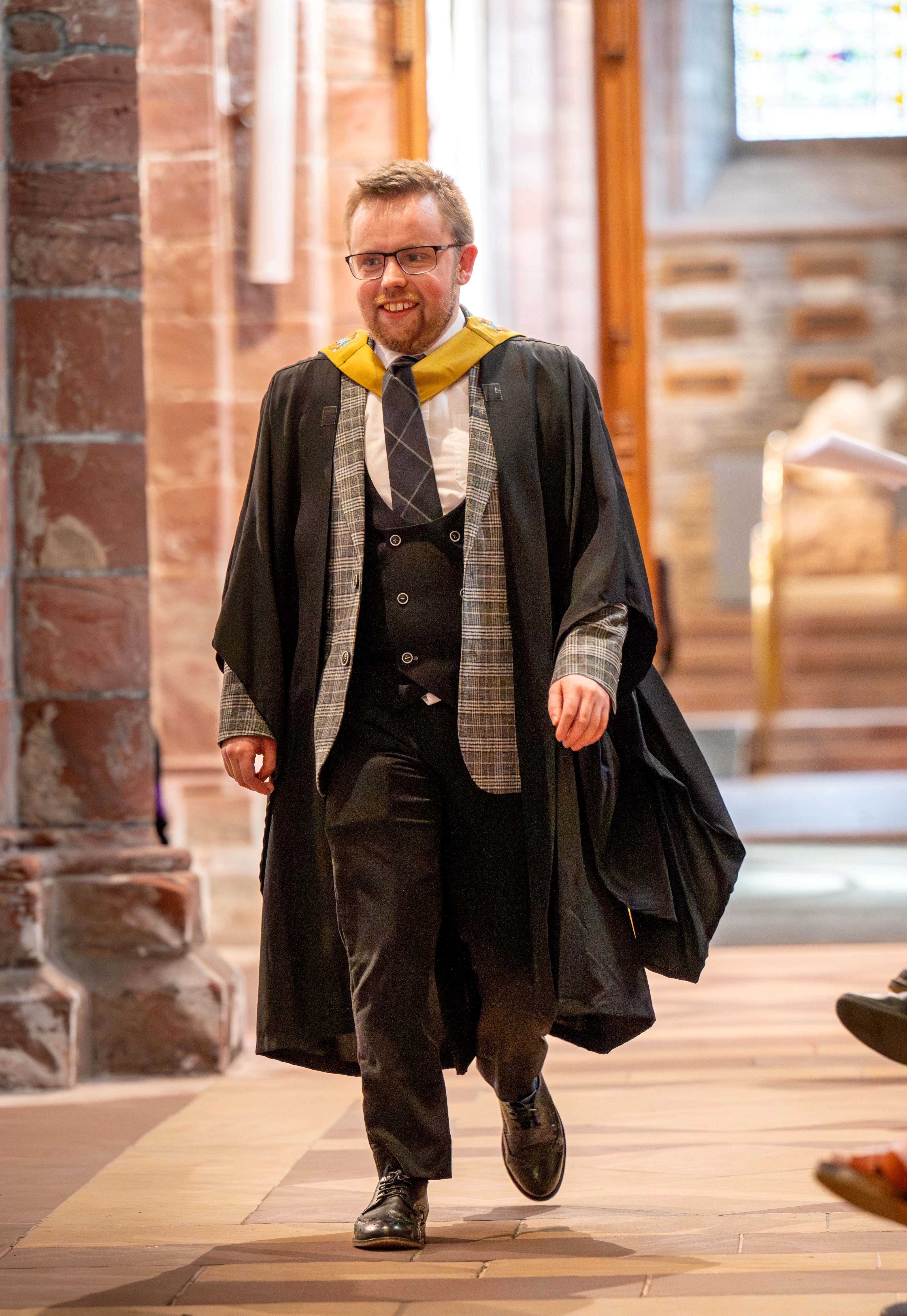 male graduate wearing academic dress