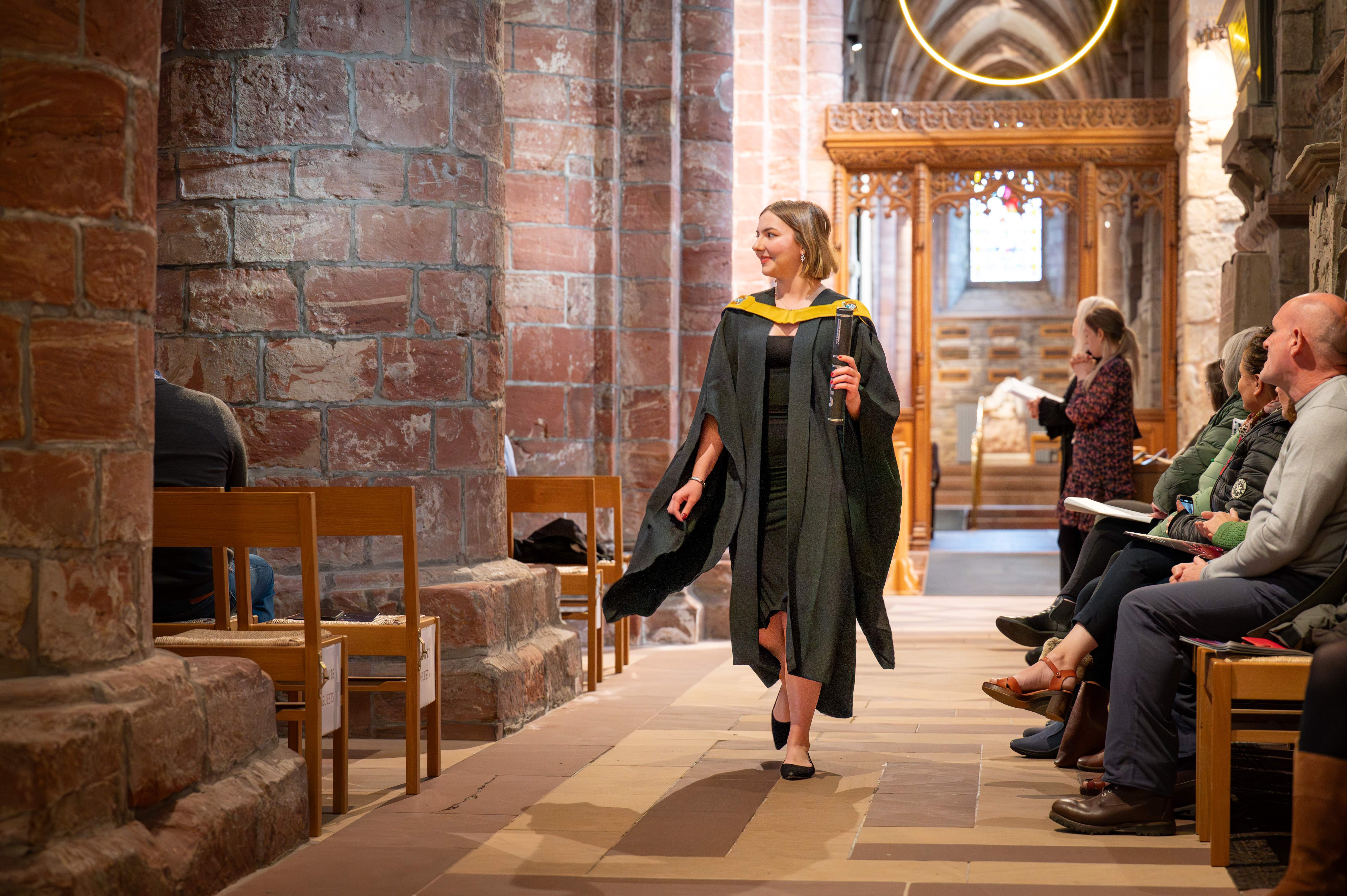 candid snap of student walking in cathedral