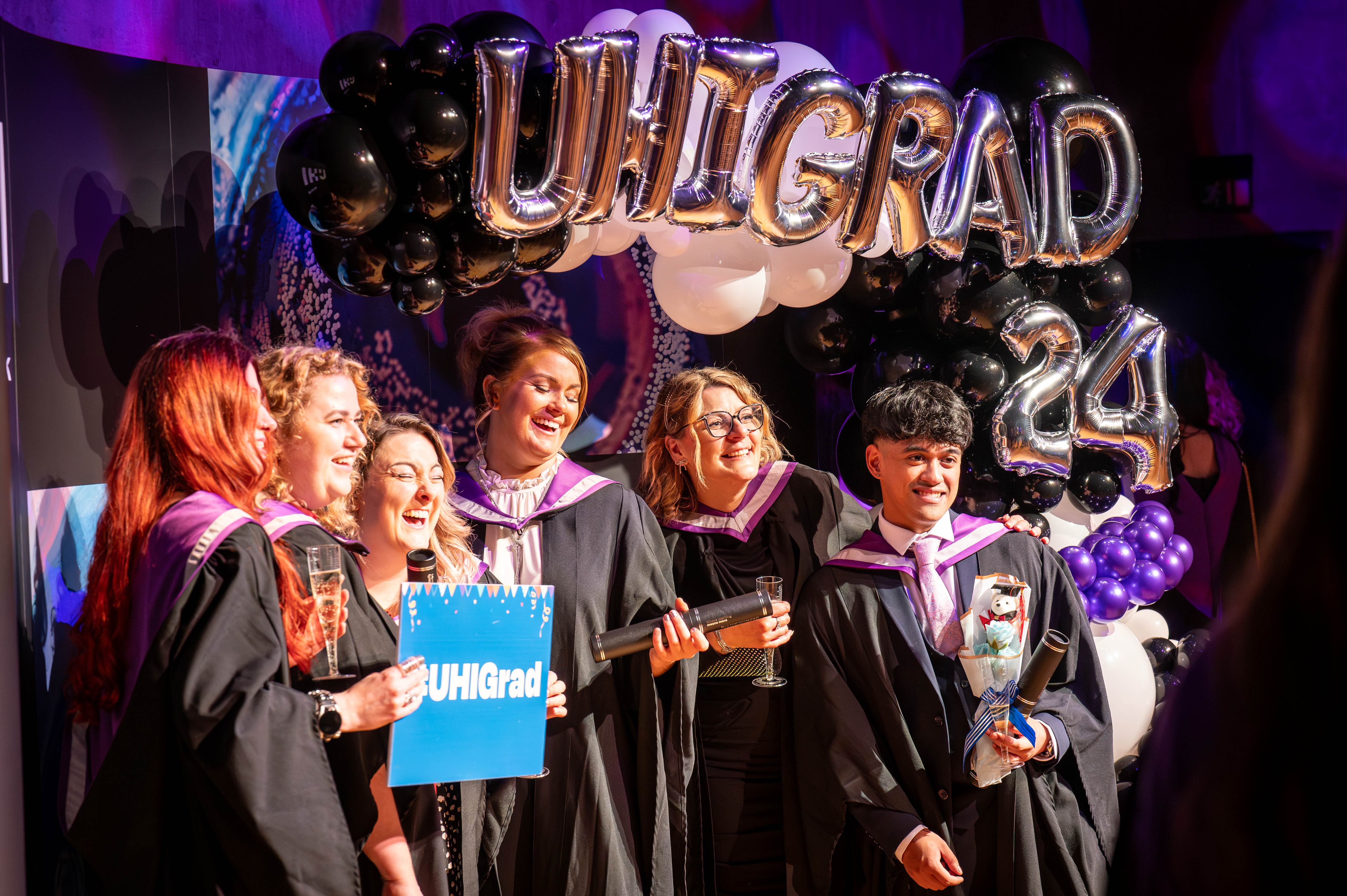 students celebrating graduation
