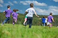 A group of kids playing in a field