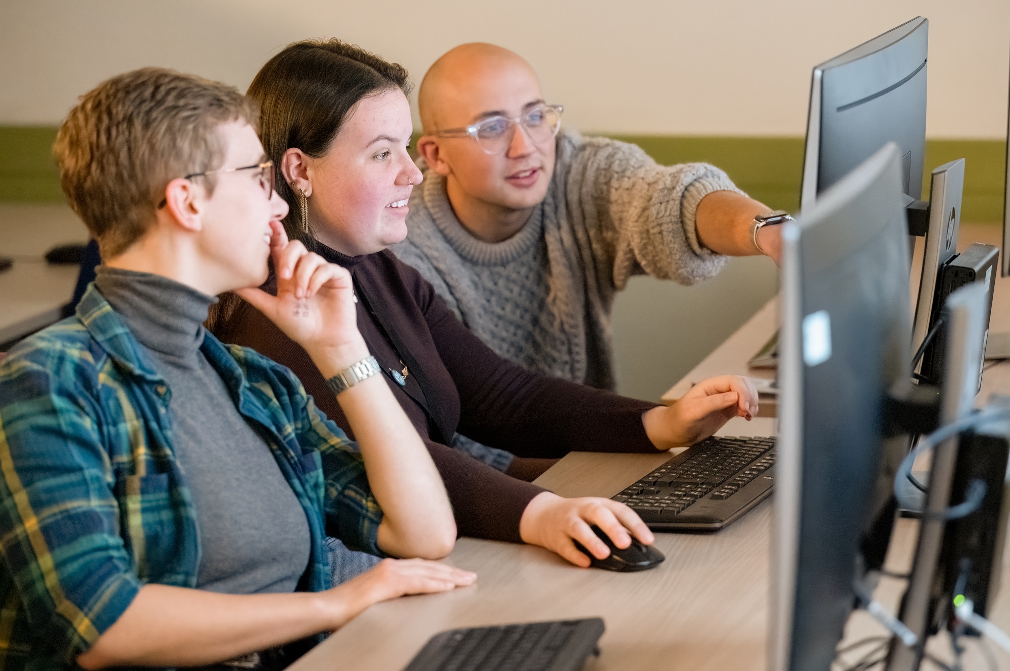 3 students using computers