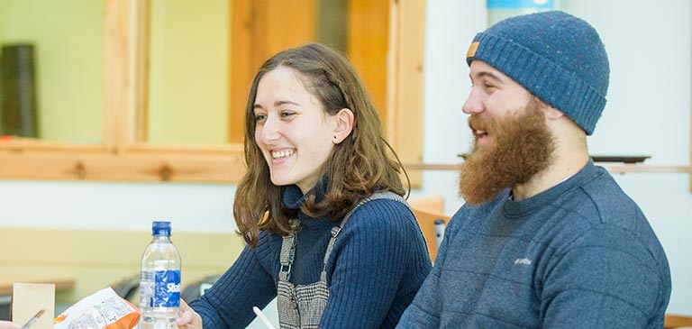 Three students sitting in the Orkney College UHI cafeteria