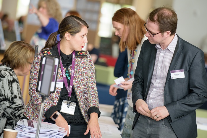 People talking at a conference